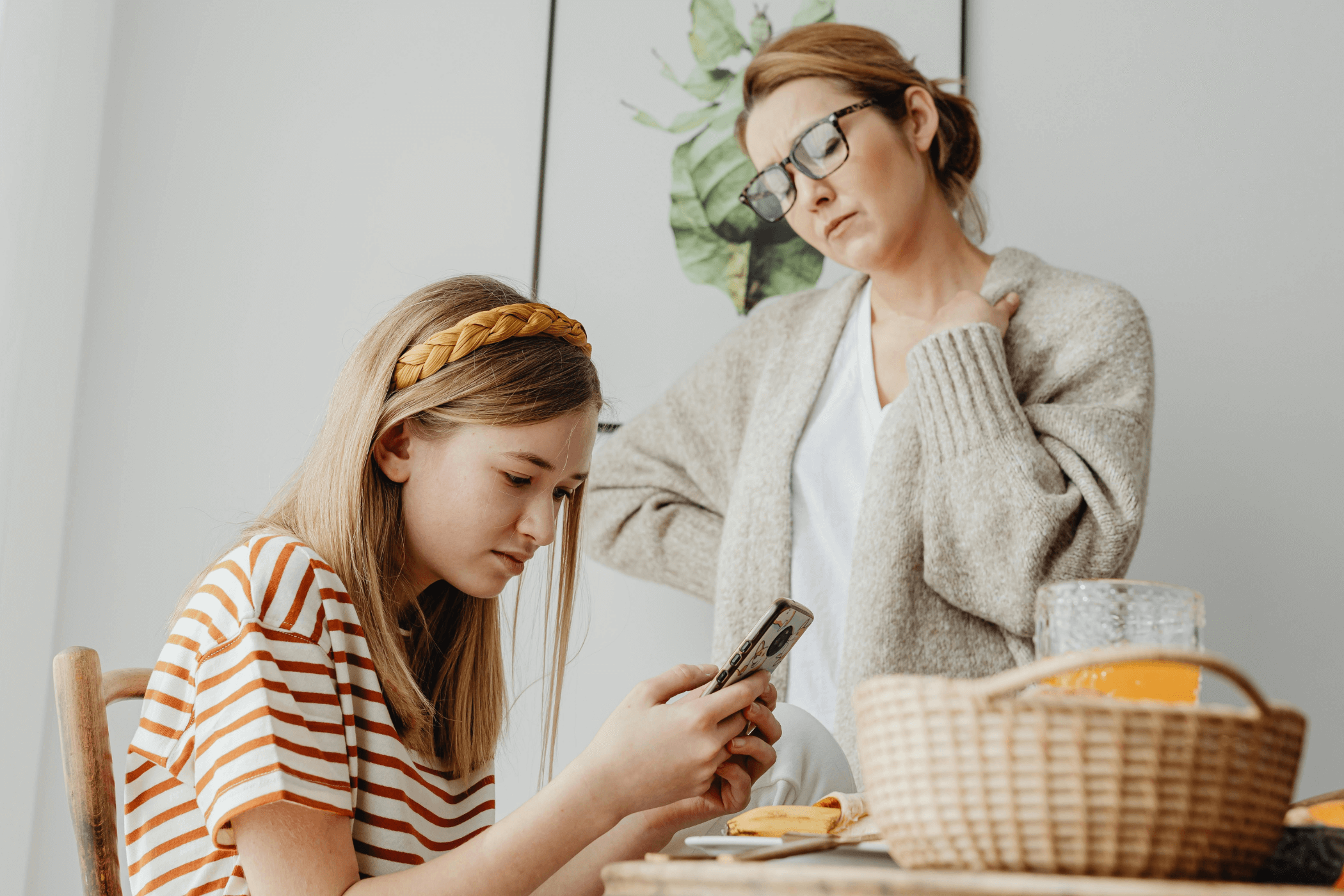 Concerned mom looking at phone